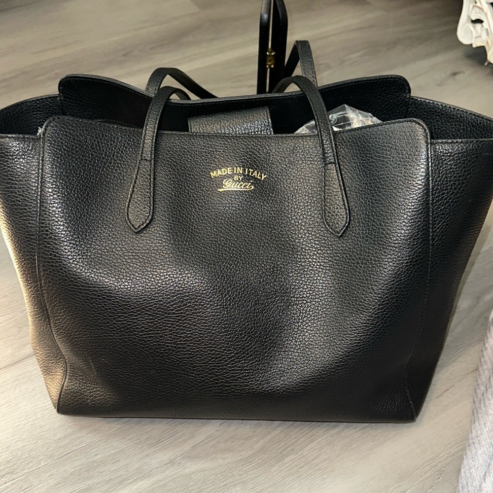 Gucci, black leather, huge tote great used condition no tears no rips no smells